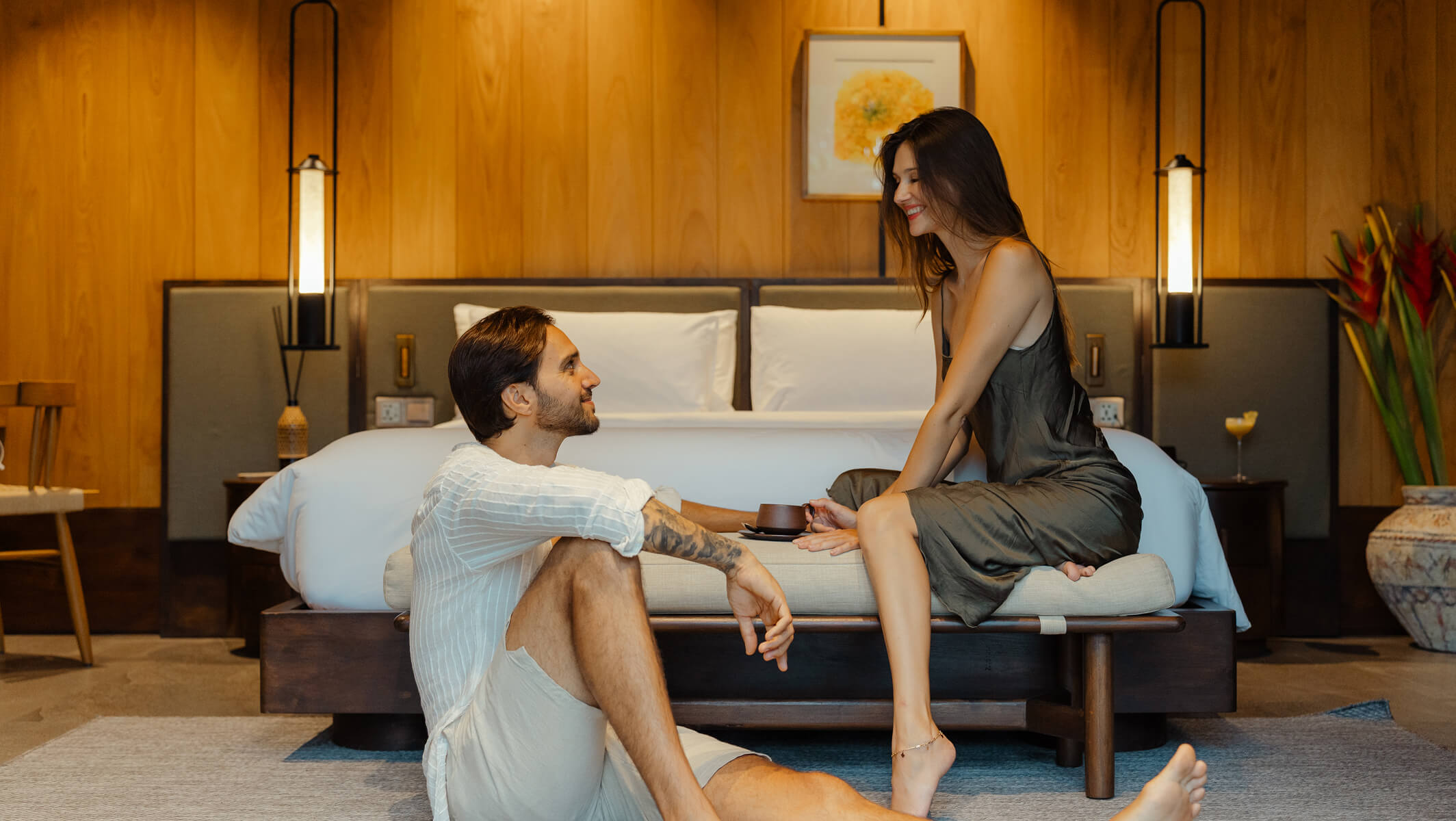 Couple enjoying a relaxed morning in a cozy resort room