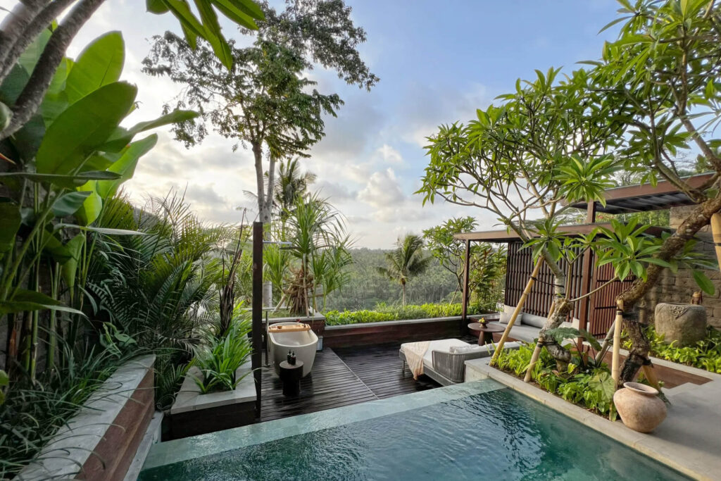 Private villa pool and bathtub with lush jungle view in Bali